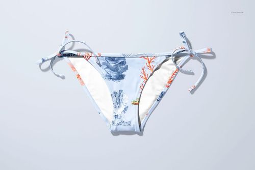 Front view of bikini bottom mockup with blue and orange coral pattern, displayed on a light background.