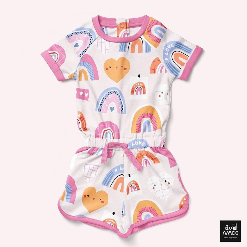 Girls cotton playsuit mockup featuring a colorful love and rainbow pattern with pink trim, displayed on a light background.