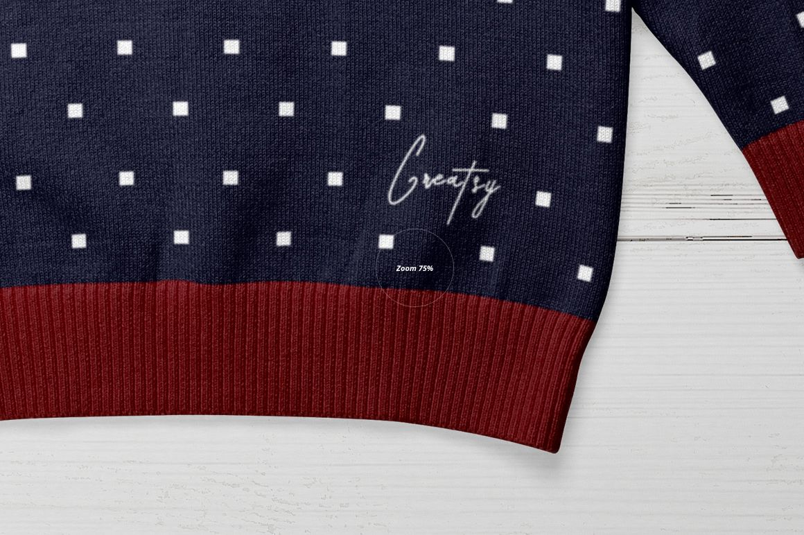 Kids turtleneck mockup showing navy fabric with white square design and red ribbed trim, displayed on wood background.