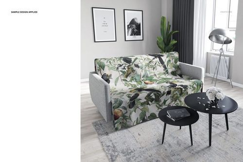 PSD mockup showing a sofa with a nature-inspired patterned coverlet, round black tables, and minimalistic decor.