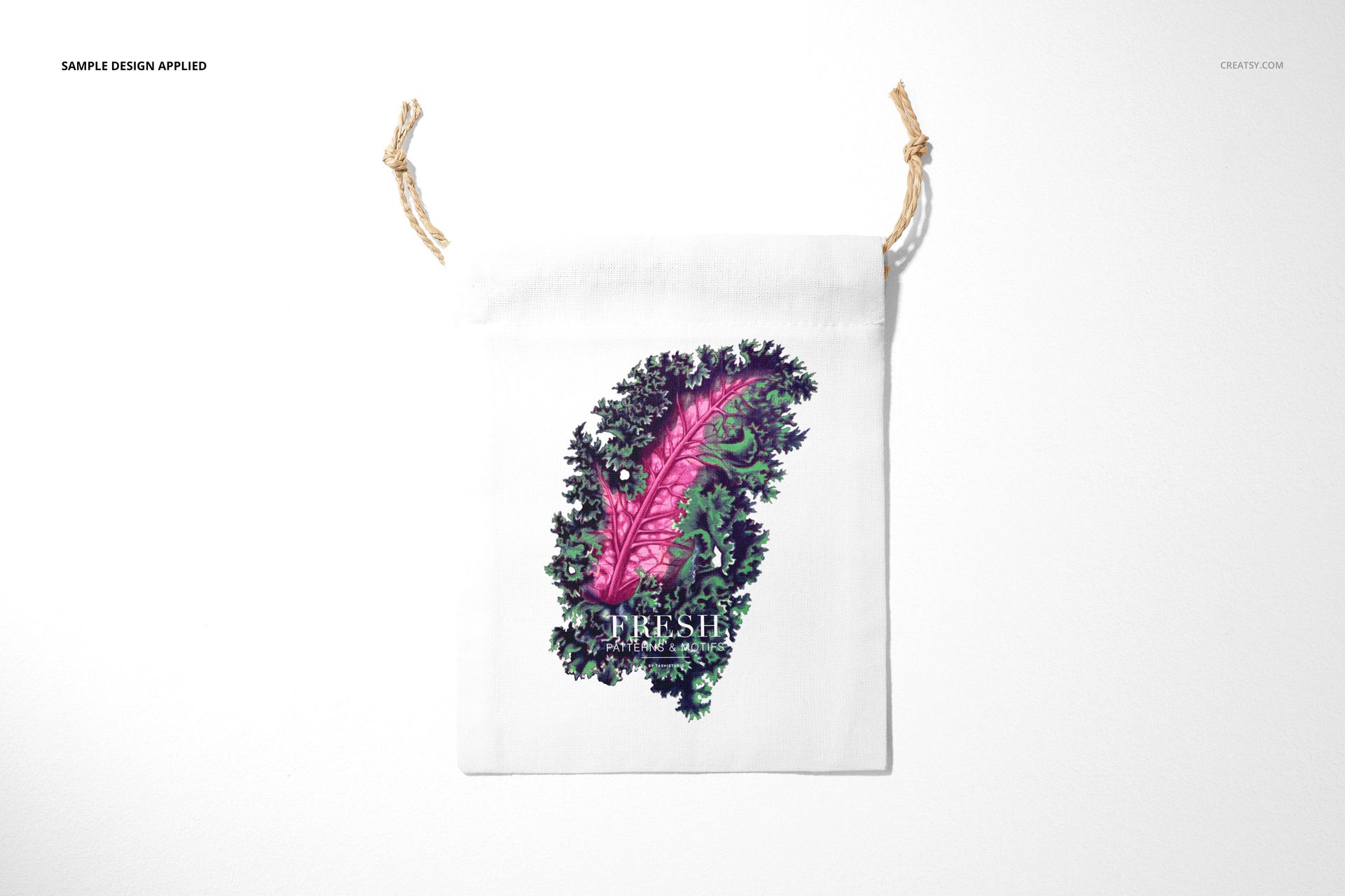White linen pouch mockup with drawstring closure, displaying a vibrant pink and green leaf pattern on the front.