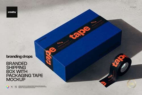 PSD mockup of a blue packaging box with bold orange tape, displayed with matching tape roll on a neutral background.
