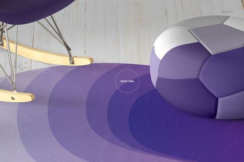 PSD mockup showing a purple patterned carpet with a geometric pouf and metal rocking chair legs on pale wooden floor.