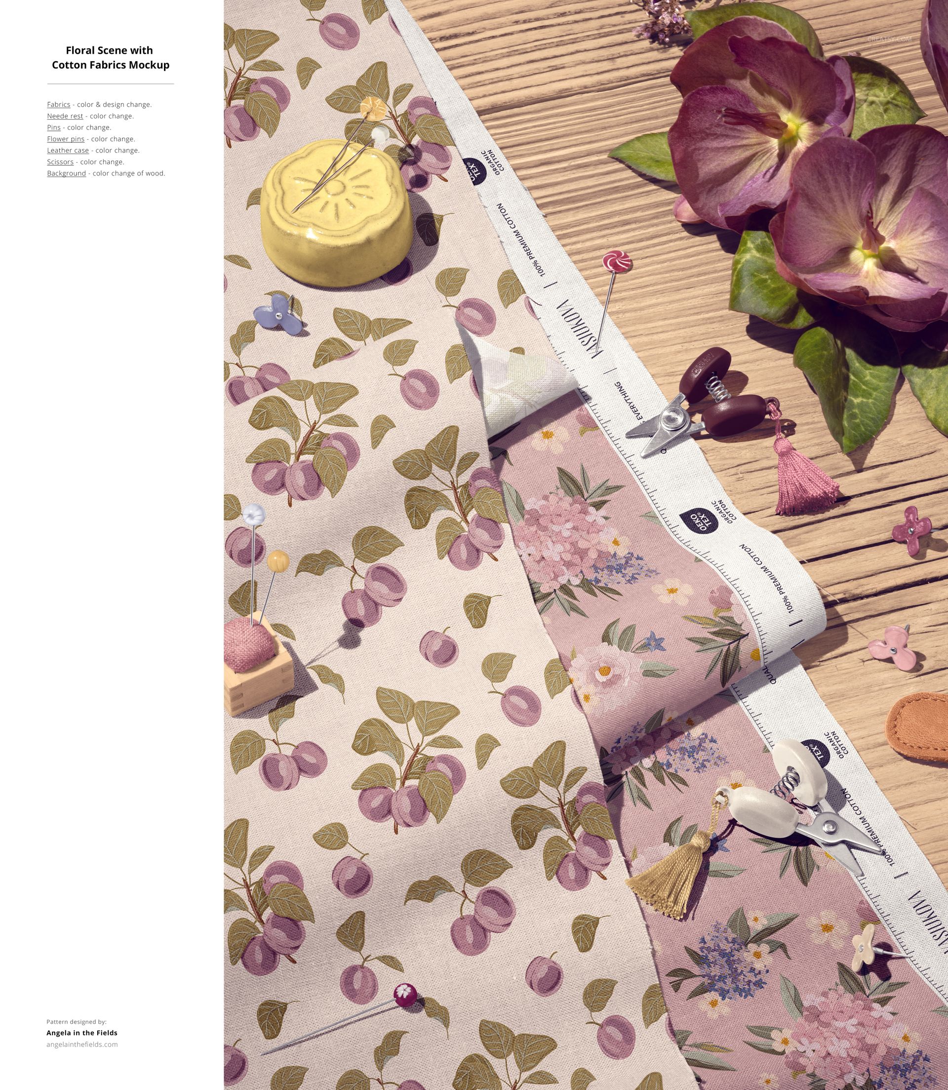Cotton fabric mockup with floral and cherry patterns, arranged on a wooden surface with sewing tools and flowers.