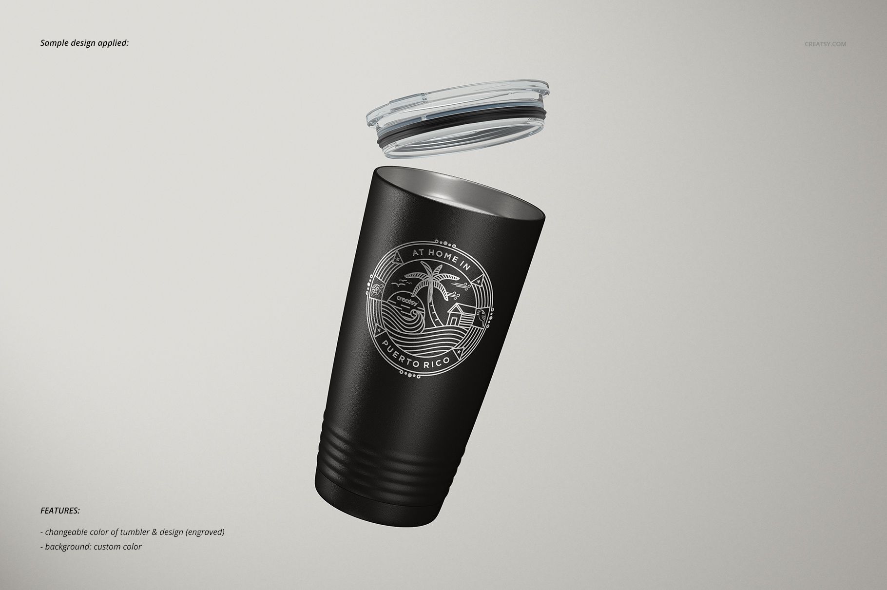 Stainless steel tumbler mockup in matte black with white tropical design, shown at an angle with lid floating above.