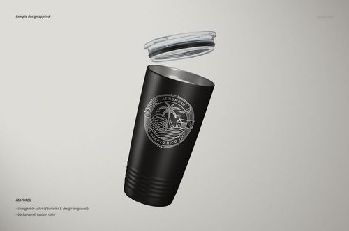 Stainless steel tumbler mockup in matte black with white tropical design, shown at an angle with lid floating above.