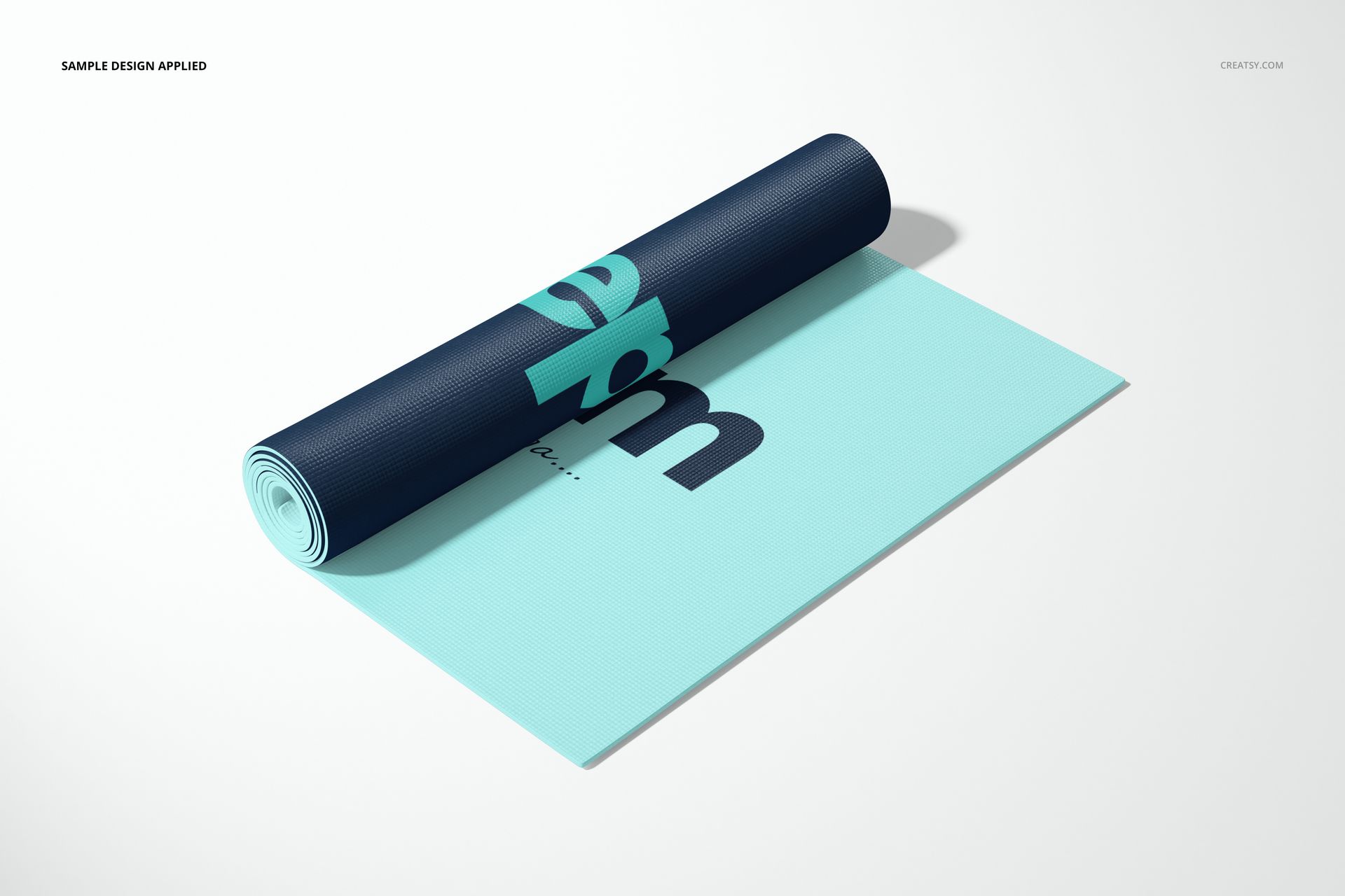 Exercise mat mockup featuring a rolled navy blue mat with turquoise accents on a flat turquoise mat, front angled view.