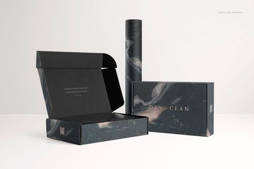 Mailing box mockup set featuring three packaging items with dark marble patterns, displayed on a light surface.