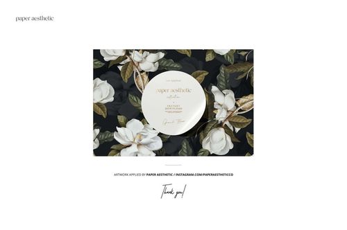 Chocolate bar packaging mockup with a floral pattern featuring white magnolia flowers and green leaves on a dark background, front view.