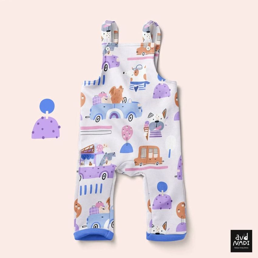 Kids fleece dungarees mockup featuring playful animal and vehicle illustrations in pastel colors on a light background.