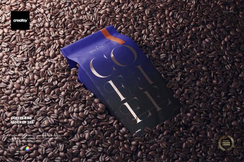 Coffee bag mockup featuring a matte finish, dark blue color, and gold accents surrounded by coffee beans.
