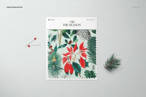 Fabric swatch mockup displayed from a top view, featuring a botanical pattern with red and green leaves on a light background.