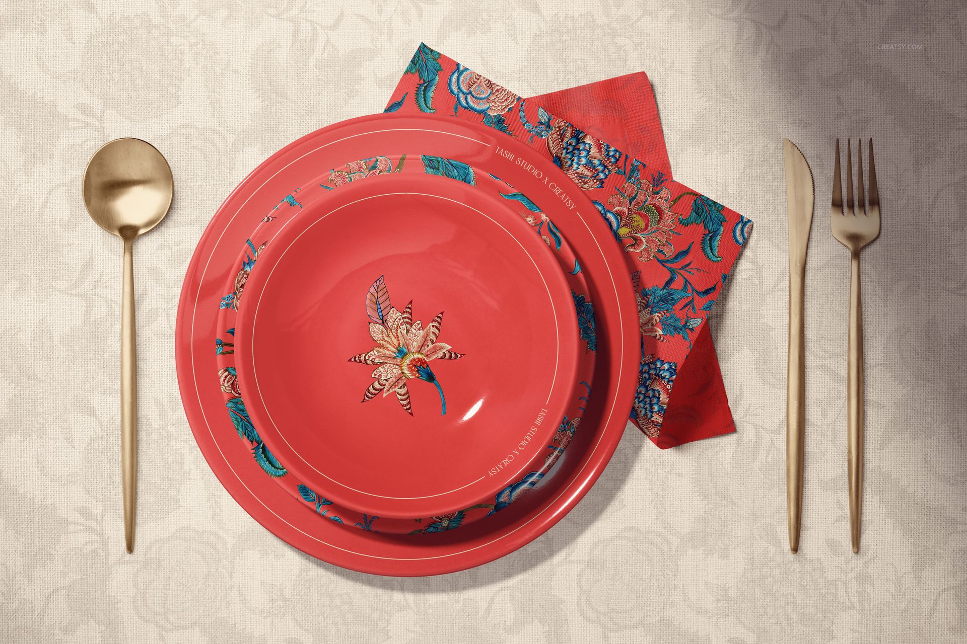 Ceramic plates mockup showing two red plates with intricate flower motifs, accompanied by a matching napkin and cutlery.