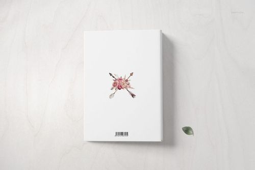 Family book mockup set displaying a white book cover with a central floral motif, viewed from a top-down perspective.