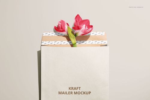 Front view of a kraft mailer mockup with two red and white flowers inside, set against a plain light background.