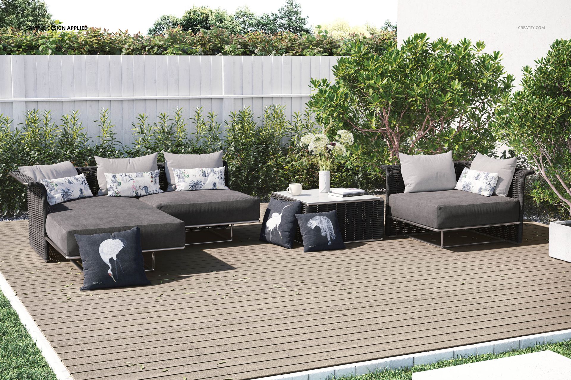 Modern patio furniture mockup featuring cushioned lounge chairs and decorative pillows in a green garden setting.
