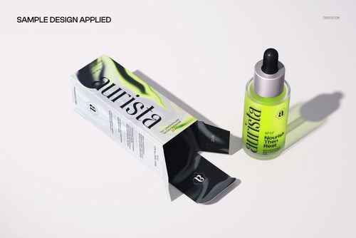 PSD mockup of a dropper bottle and open carton, both with bold green and black design elements on a white background.