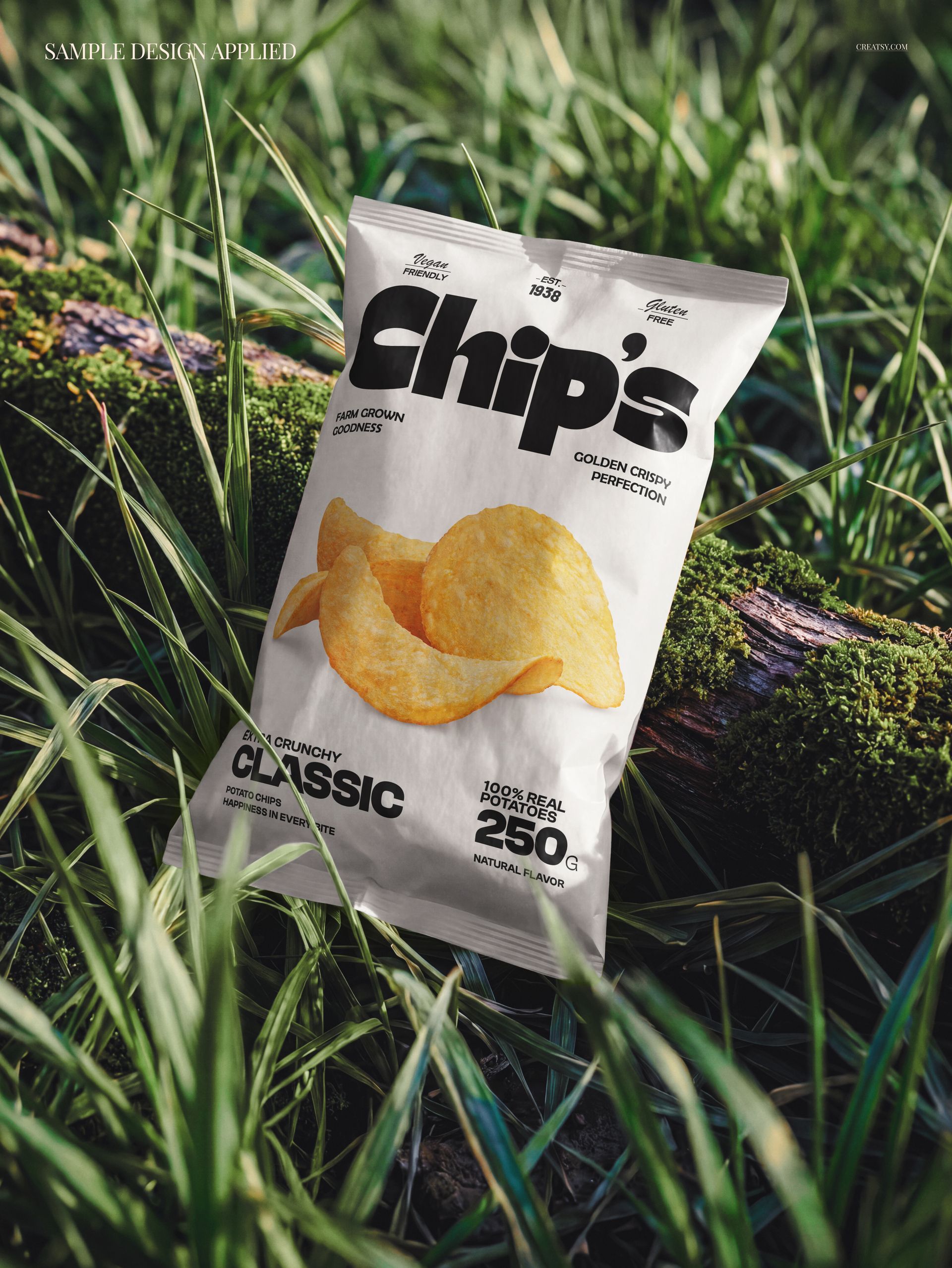 PSD mockup of a classic chips packaging placed on a moss-covered log with tall grass in a natural outdoor setting.