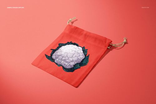 Coral-colored linen pouch mockup featuring a cauliflower design, shown with drawstrings on a solid pink background.