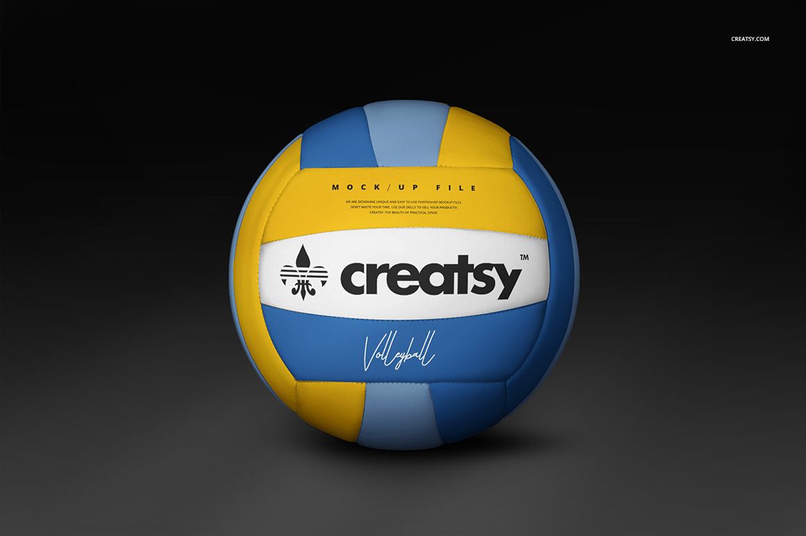 PSD mockup of a volleyball ball with alternating blue, yellow, and white panels, centered against a dark backdrop.