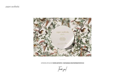 Front view of a knitted romper mockup with a nature-inspired pattern featuring birds, leaves, and pinecones on a white background.