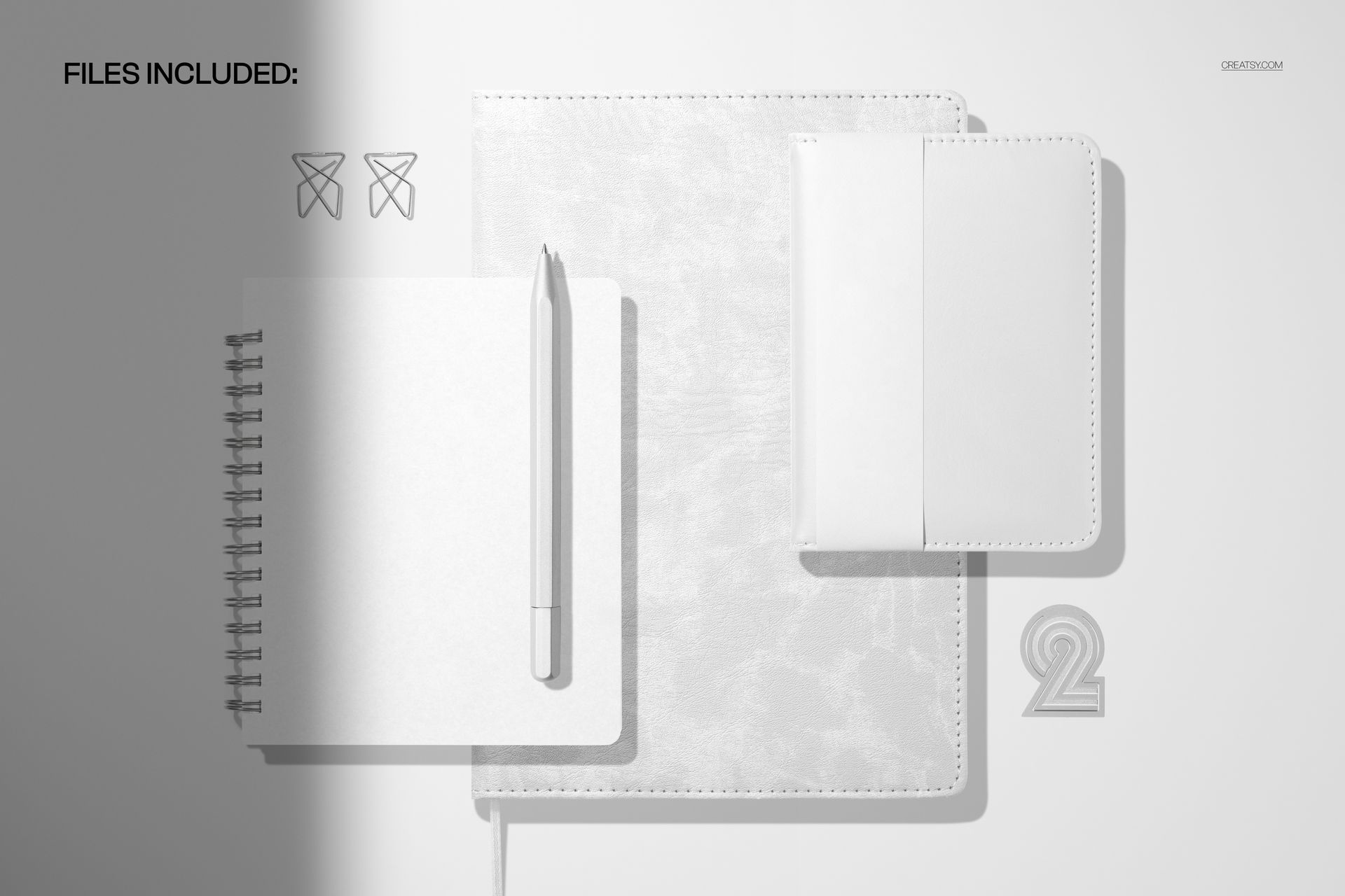 Flat lay of a leather calendar spiral journal, pocket calendar, and pen on a light background, shown as a PSD mockup.