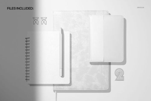 Flat lay of a leather calendar spiral journal, pocket calendar, and pen on a light background, shown as a PSD mockup.