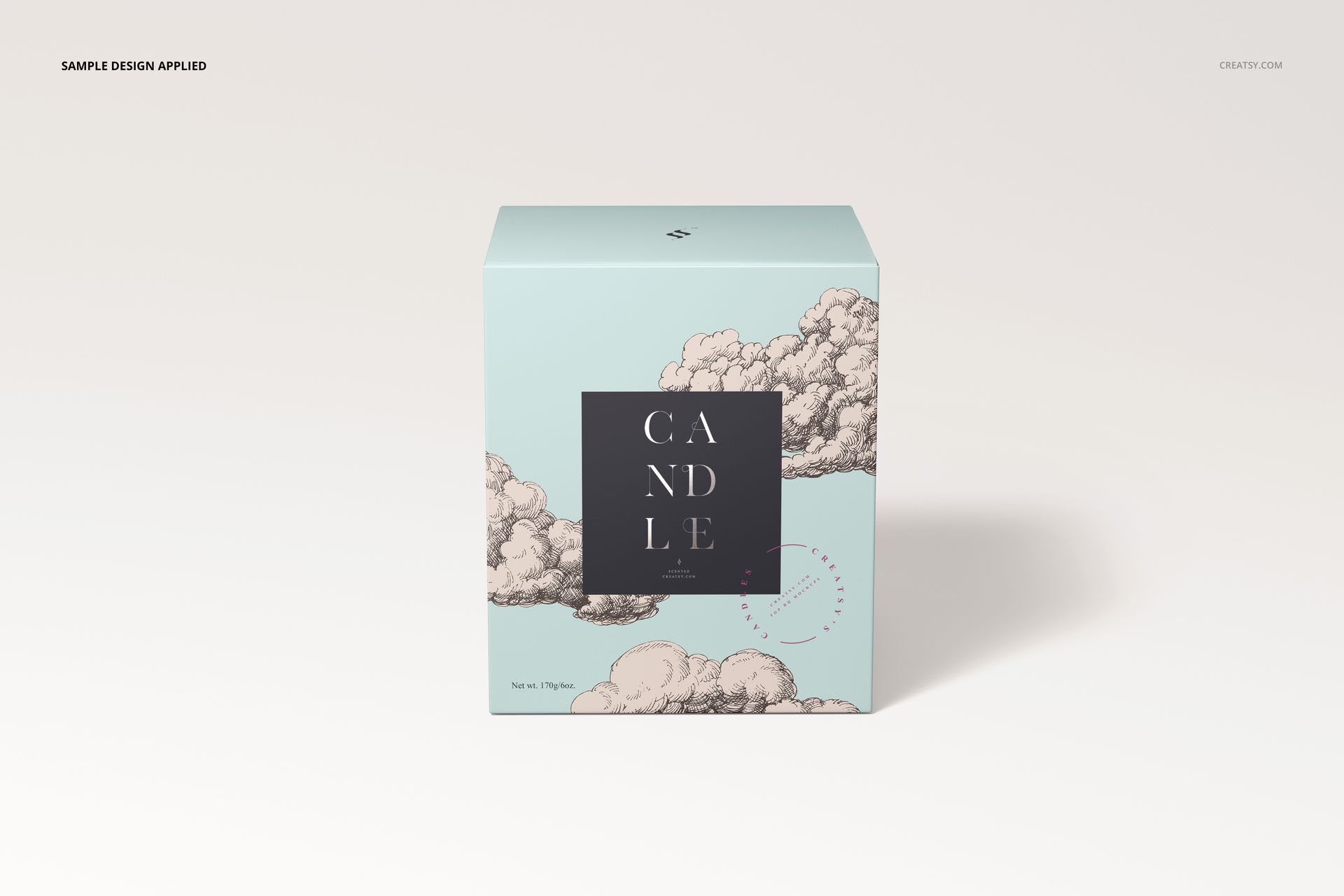 Front view of a cotton wick candle box mockup with a light blue background and illustrated cloud pattern.