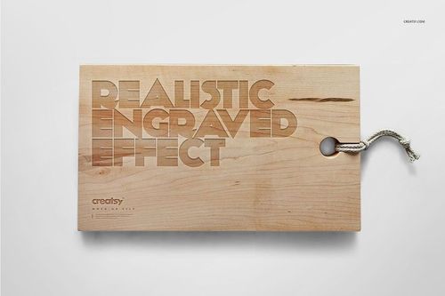 Engraved wooden board mockup featuring a rope loop, realistic wood texture, and top-down perspective on white.