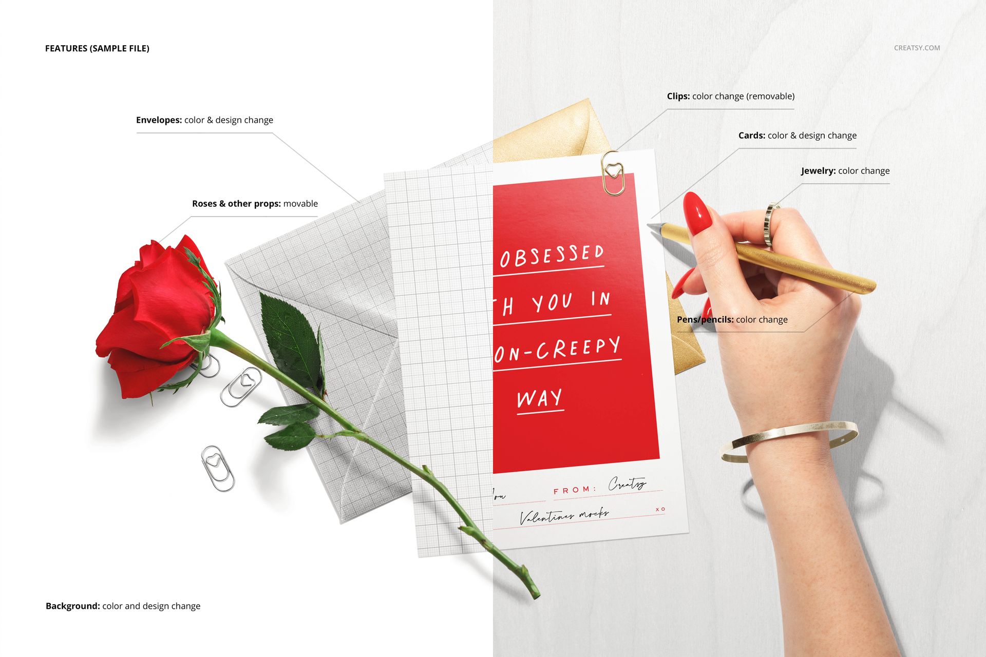 Top view of stationery mockup set featuring a red rose, envelopes, paper clips, greeting card, and a hand holding a pencil.