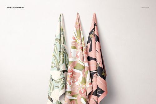 Hanging Fabrics Mockup Set showing three textile samples with nature-inspired prints in muted green and pink shades.
