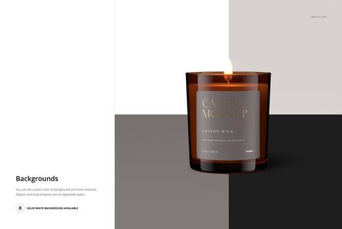 PSD mockup of an amber glass jar candle with matte lid, cotton wick, and flame, set against neutral blocks.