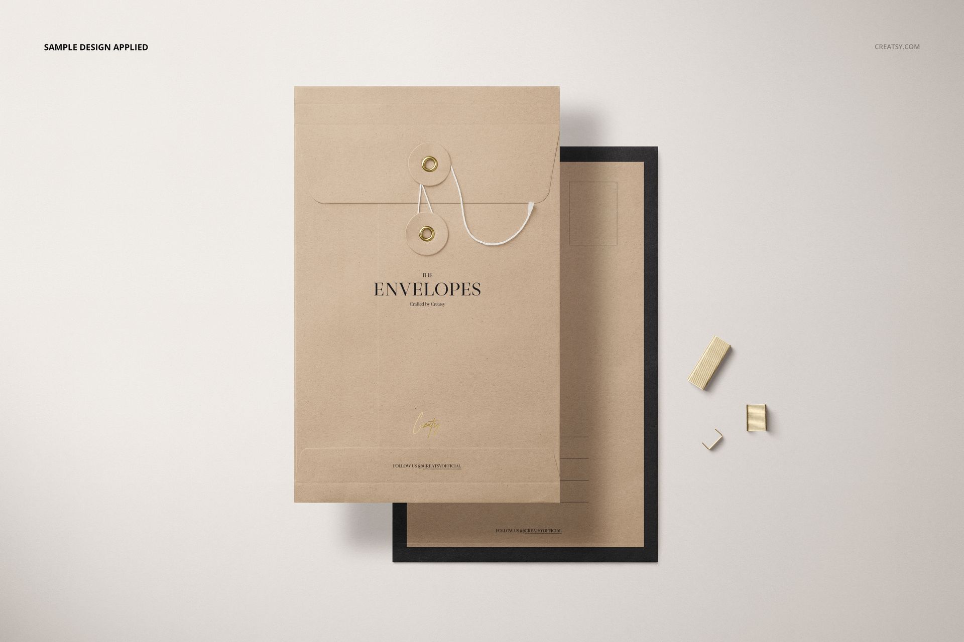 Kraft brown string envelope mockup with white cord and button detail, layered over a black-bordered envelope on a neutral background.