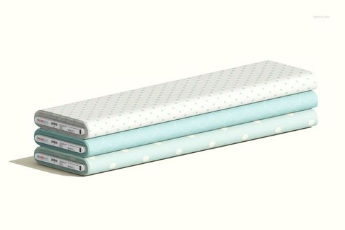 Fabric bolts mockup with soft blue and white patterns, arranged in a horizontal stack on a neutral surface.