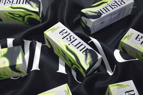 Dropper bottle mockup boxes featuring green accents and bold branding displayed atop a flowing black fabric.