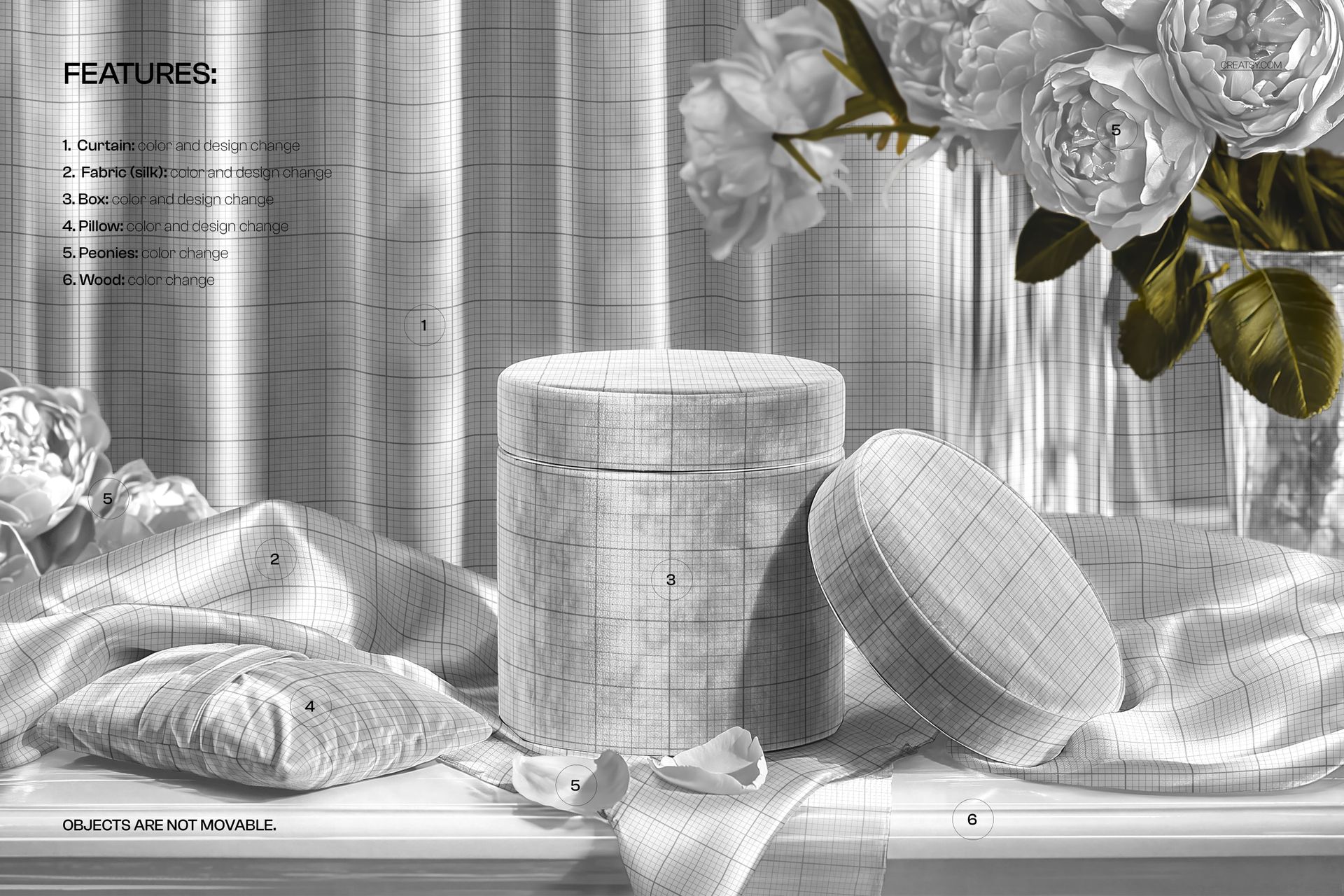Round gift box with wrapping paper and satin ribbon mockup on a draped fabric surface, surrounded by flowers.
