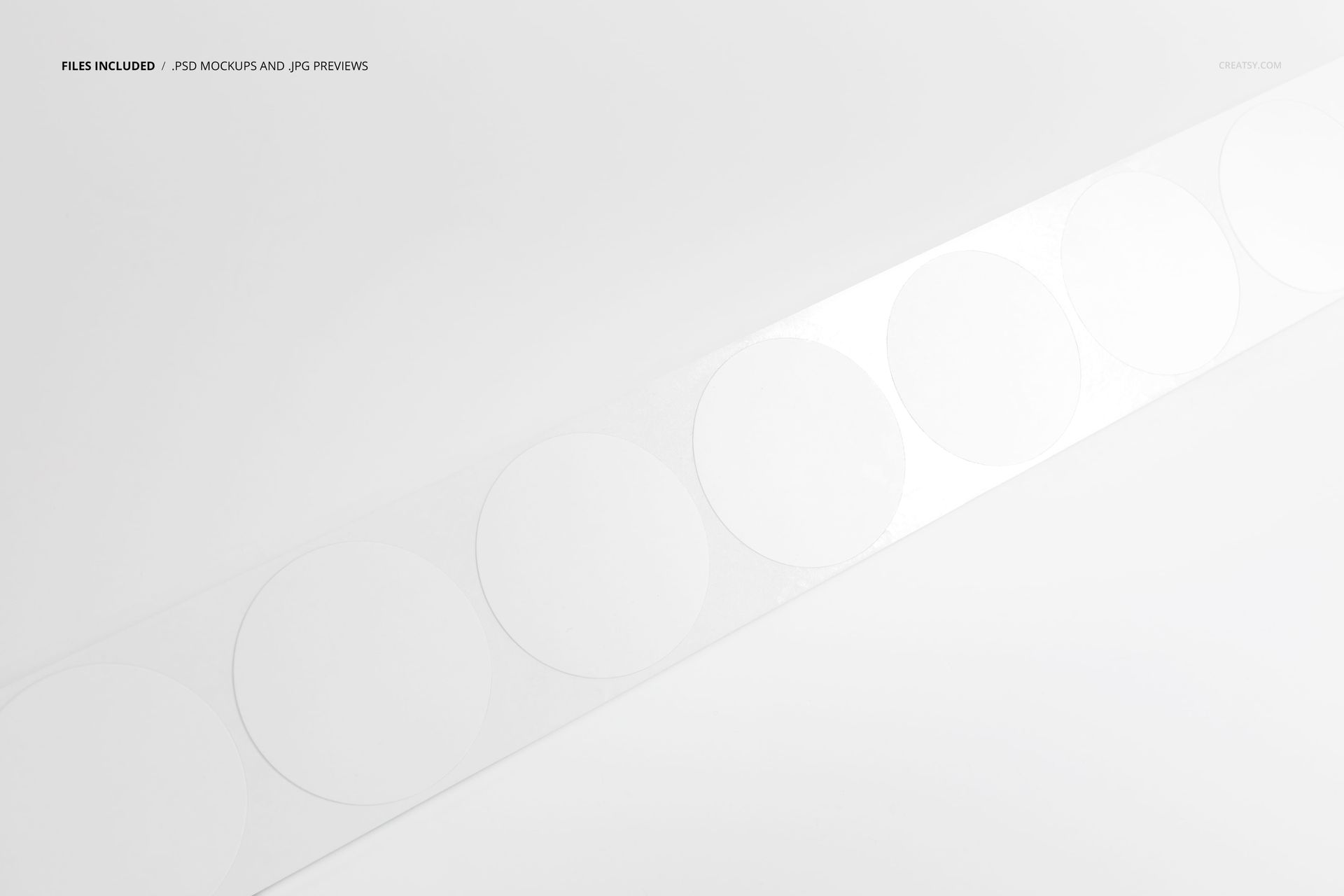 Round stickers displayed on a clear tape, shown from above against a plain white surface in a PSD mockup.