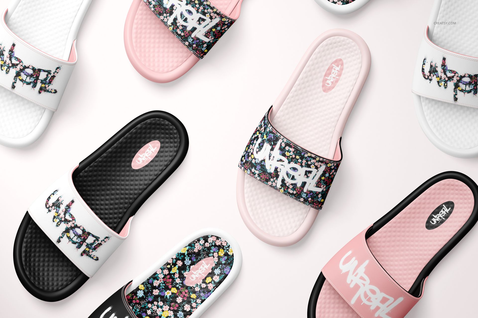 Slide sandals mockup set showing multiple pairs in black, white, and pink with floral and graphic patterns on straps.