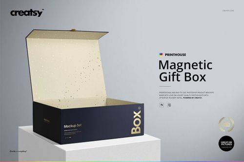 Front view of a magnetic gift box mockup with a dark blue body and beige speckled inside, placed on a light surface.