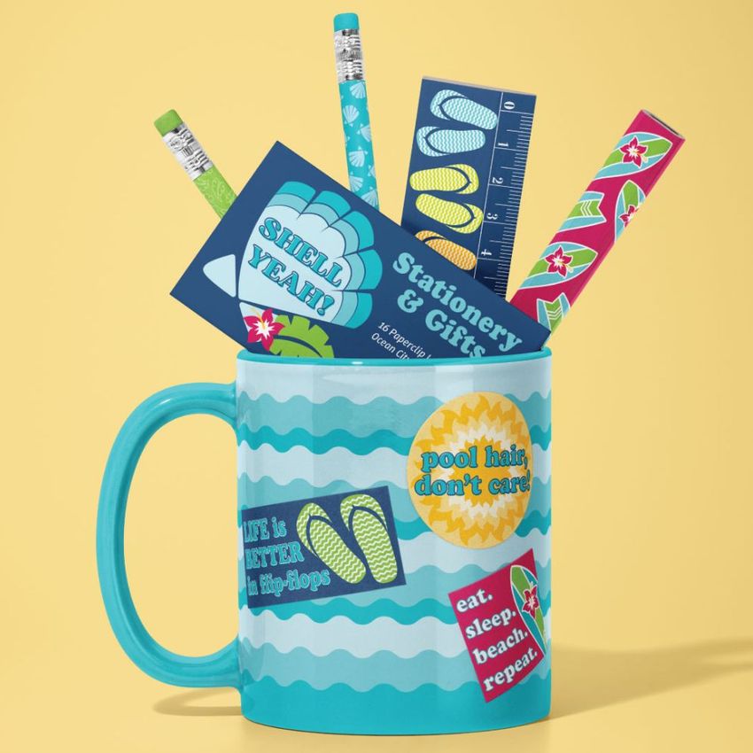 Mug mockup featuring a turquoise mug with wavy patterns, filled with stationery items like pencils, a ruler, and cards, set against a yellow background.