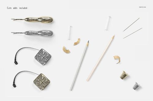 Flat lay of sewing tools and pencils on a white surface, including seam rippers, thimbles, and sharpened pencils.