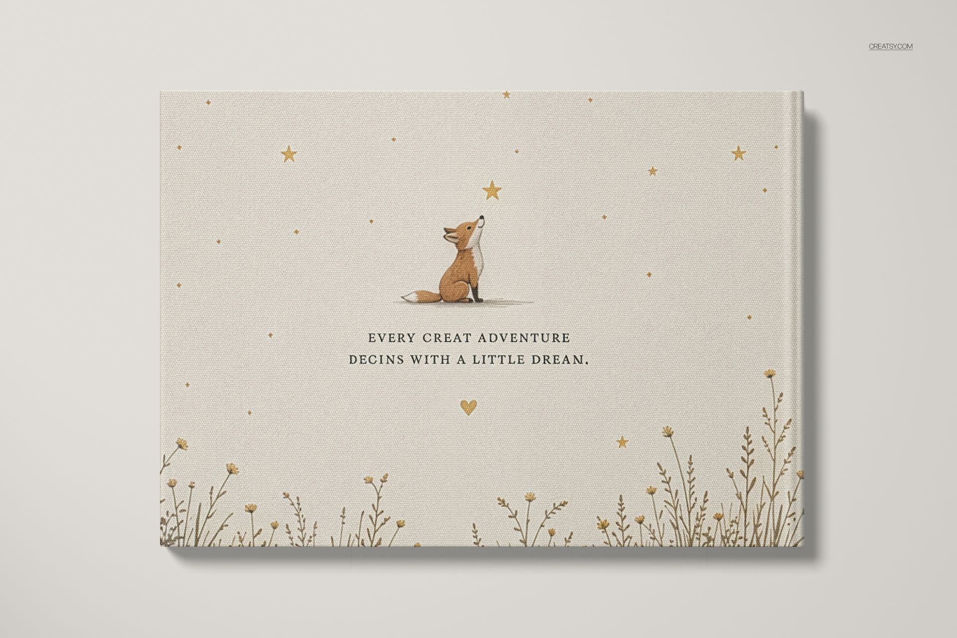 A4 landscape book mockup showing a fox illustration, gold stars, and wildflowers on a light beige cover, front view.