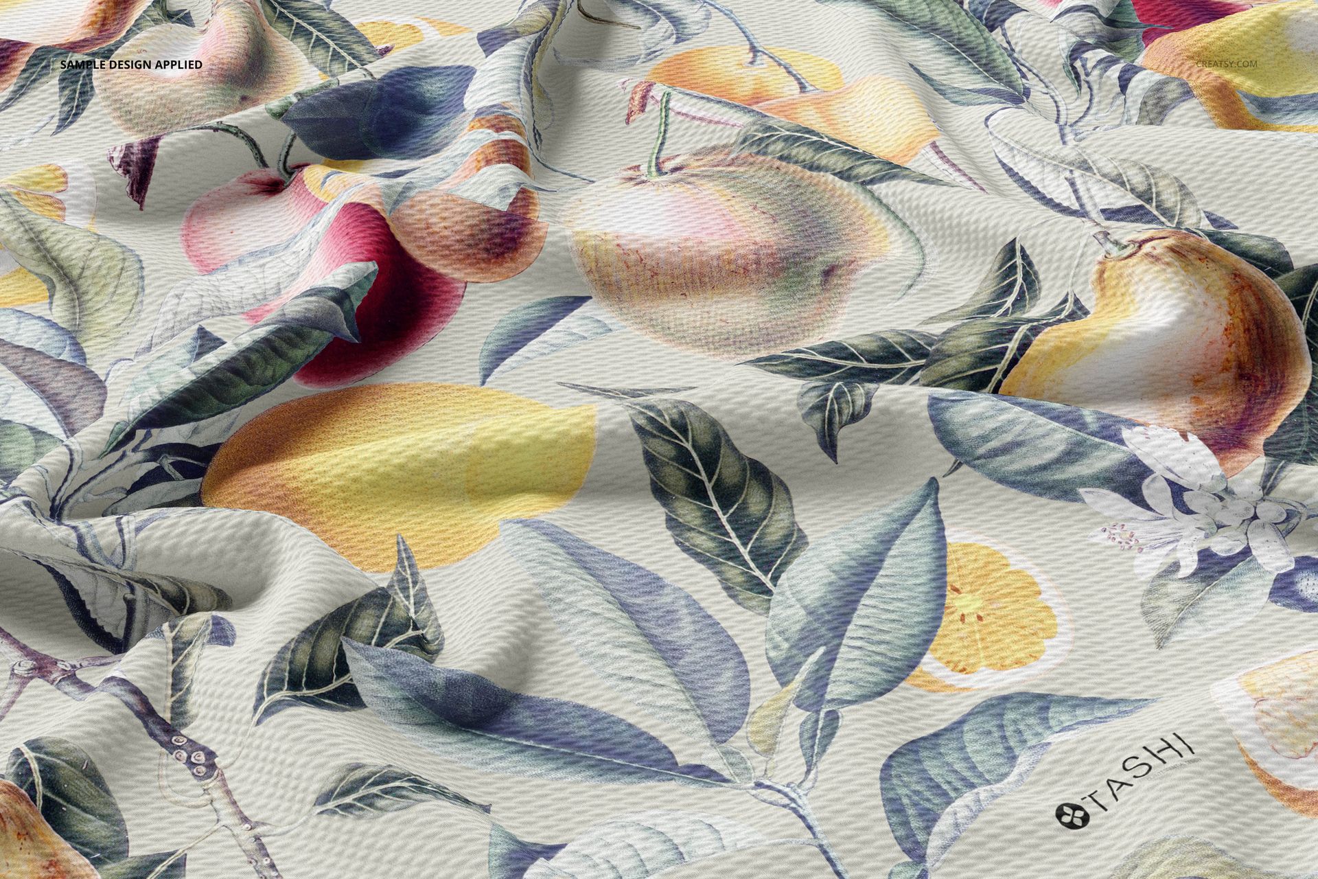 Wrinkled bullet fabric mockup featuring a fruit and leaf pattern in pastel colors, viewed from above.