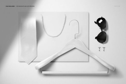 Men’s accessories brand identity PSD mockup featuring a hanger, tie, sunglasses, cufflinks, and shopping bag arranged neatly.
