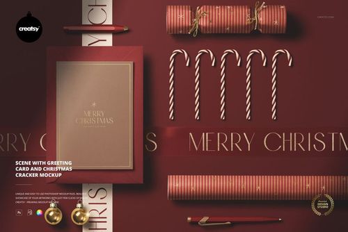 Greeting card and Christmas cracker mockup on a red background with candy canes, ribbon, and gold accents, top view.