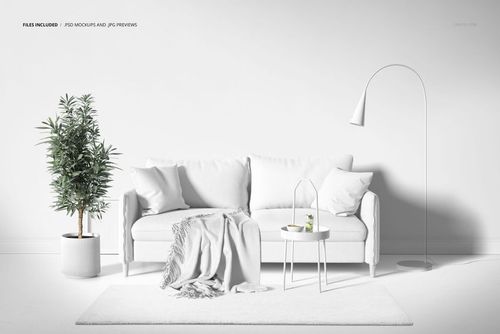 PSD mockup showing a white sofa with cushions, a blanket, a decorative table, and a sleek floor lamp in a bright room.
