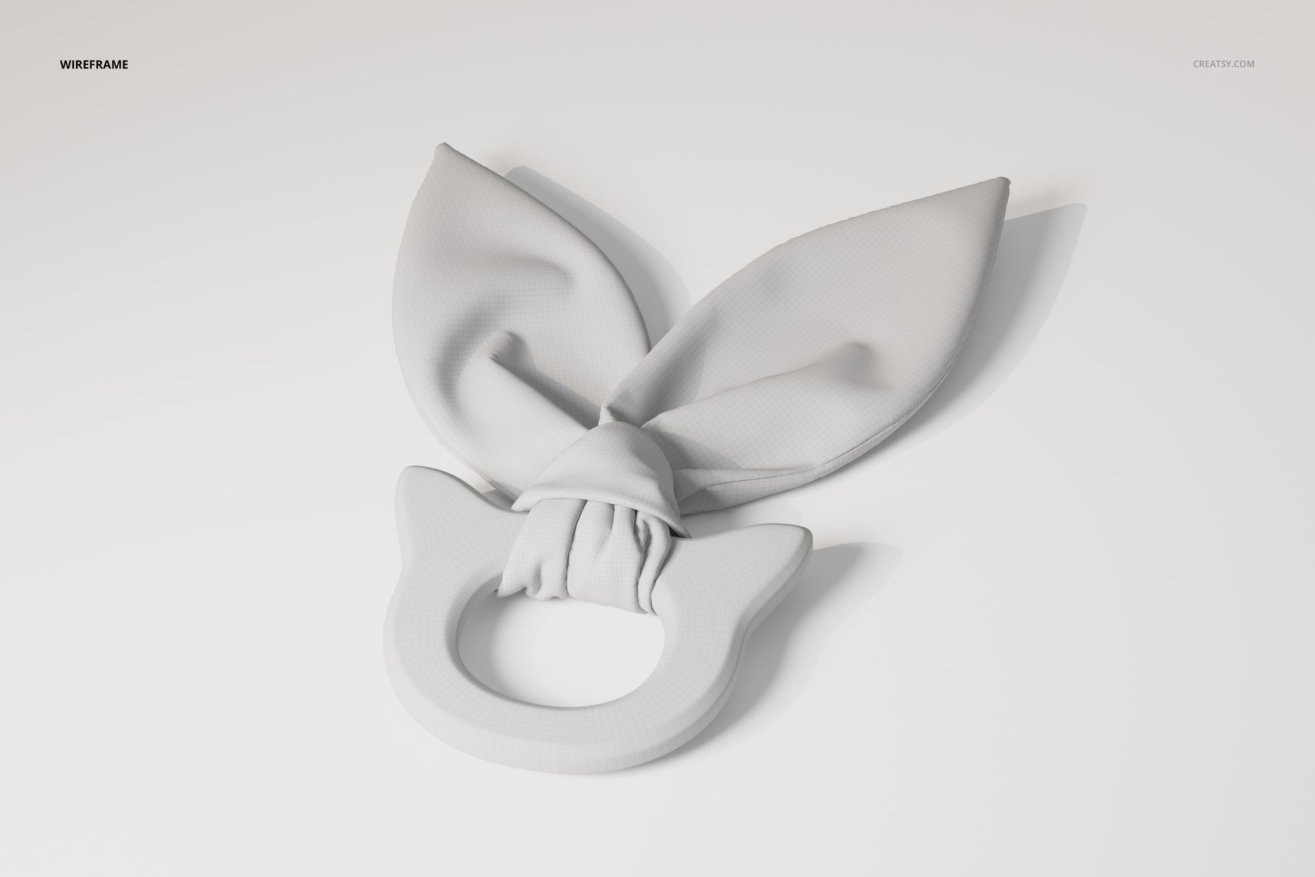 Wooden teether toy with a circular ring and two fabric bunny ear shapes, shown in a neutral wireframe view on a light background.