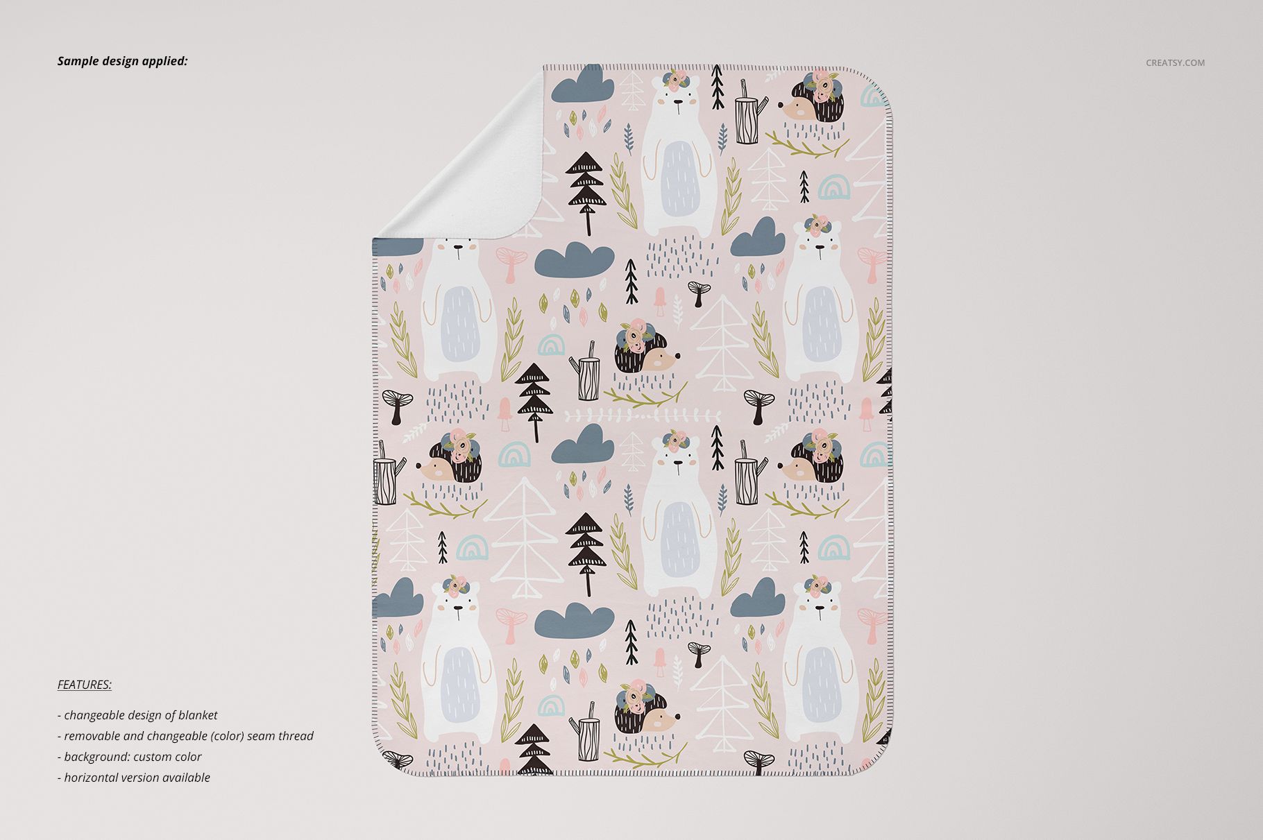 Kids blanket mockup shown flat with whimsical bear and tree illustrations in soft pink, gray, and beige tones.