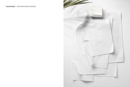 Cotton fabric swatches displayed on a wall mockup, featuring multiple rectangular pieces in a neutral white tone.