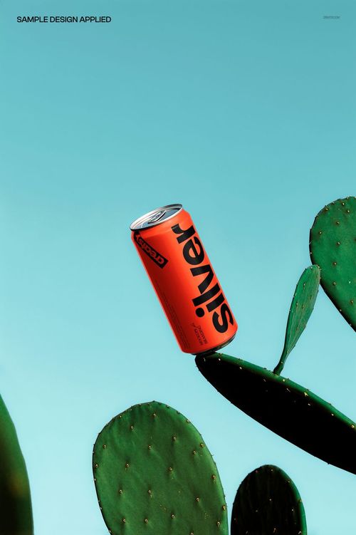 Red drink can mockup floating above green cactus pads against a bright blue background, front view.